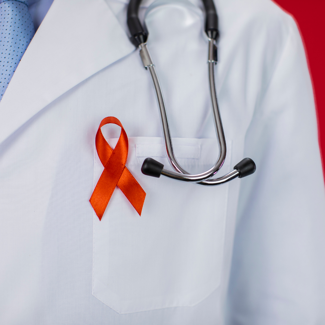 Medical doctor with red ribbon for AIDS/HIV awareness